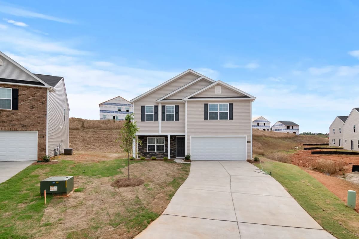 A newly built home on a street in a neighborhood still being developed