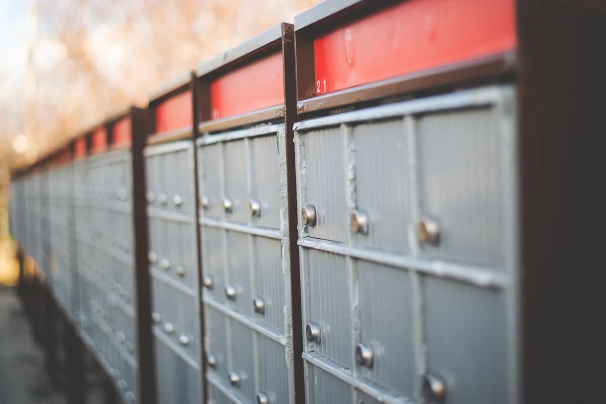 Rows of cluster mailboxes outdoors in a residential setting