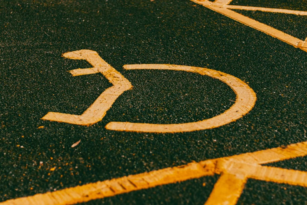 Accessible parking symbol painted on lot asphalt