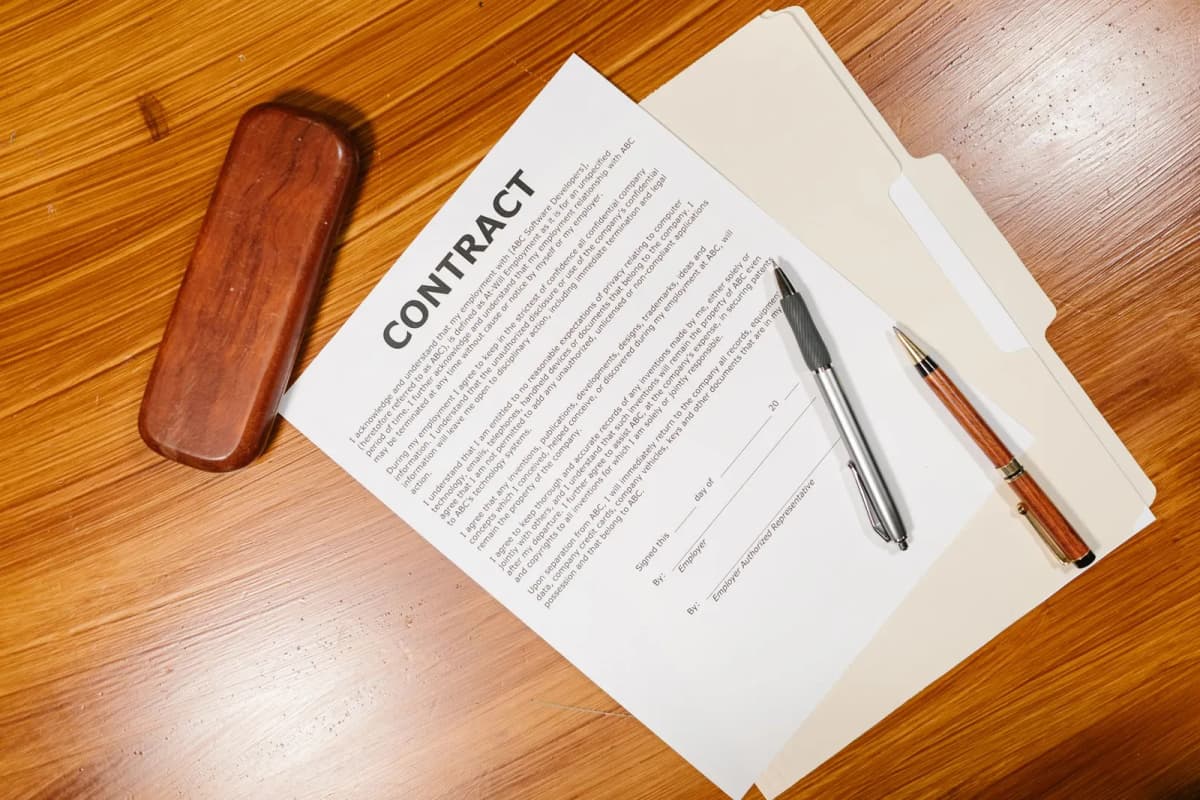 Board documents and a pen on a desk, ready for a resale request