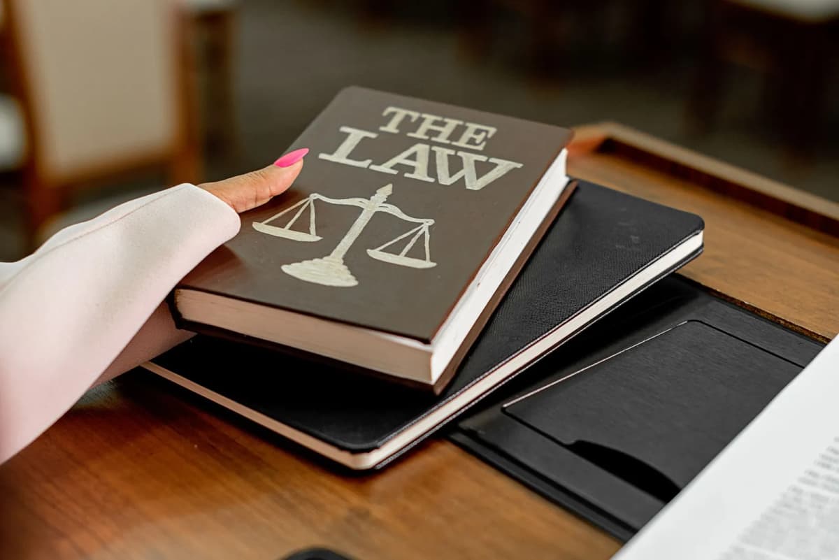A law book on a wooden desk
