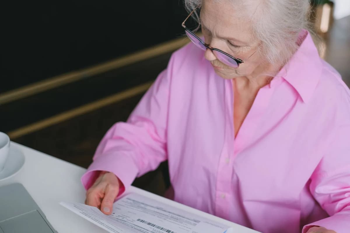 An owner reading through the community's governing documents at home