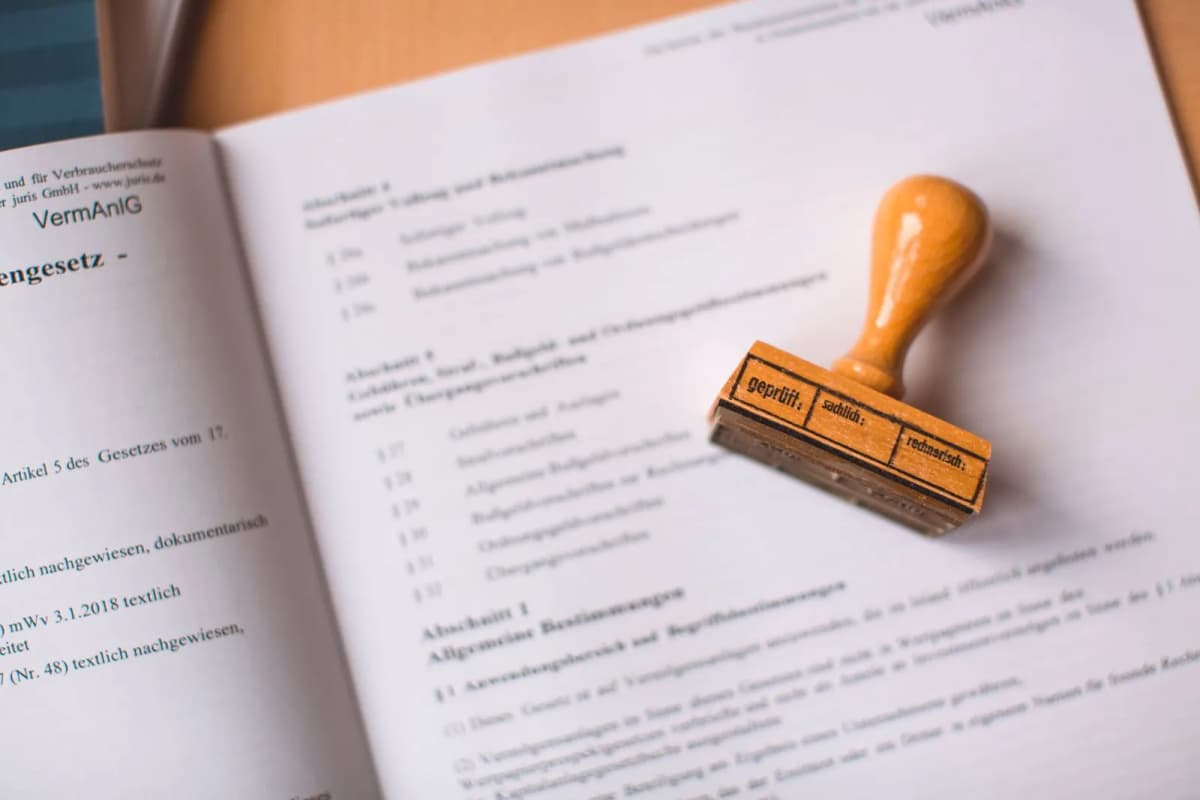 A wooden stamp resting on a legal document
