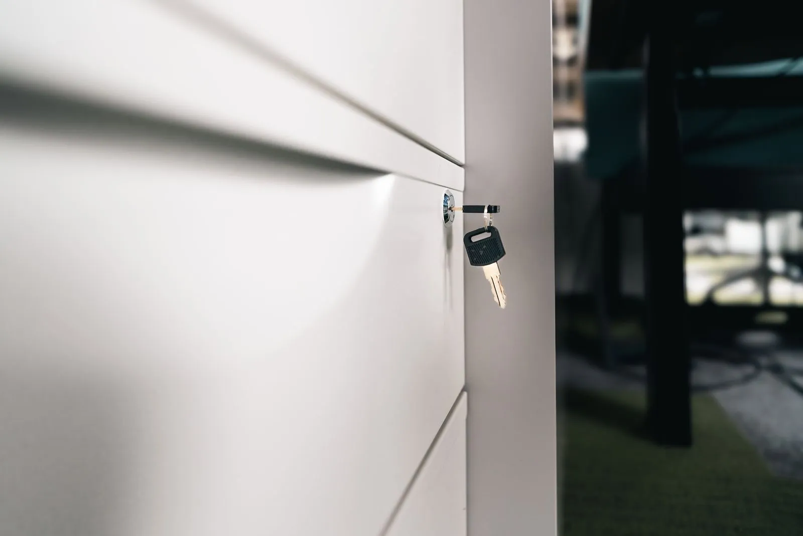 A key in the lock of a secure office drawer