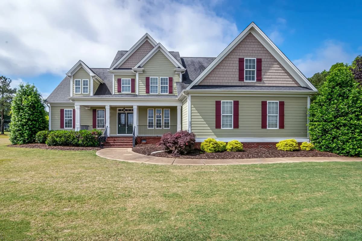 A suburban house with a manicured front lawn