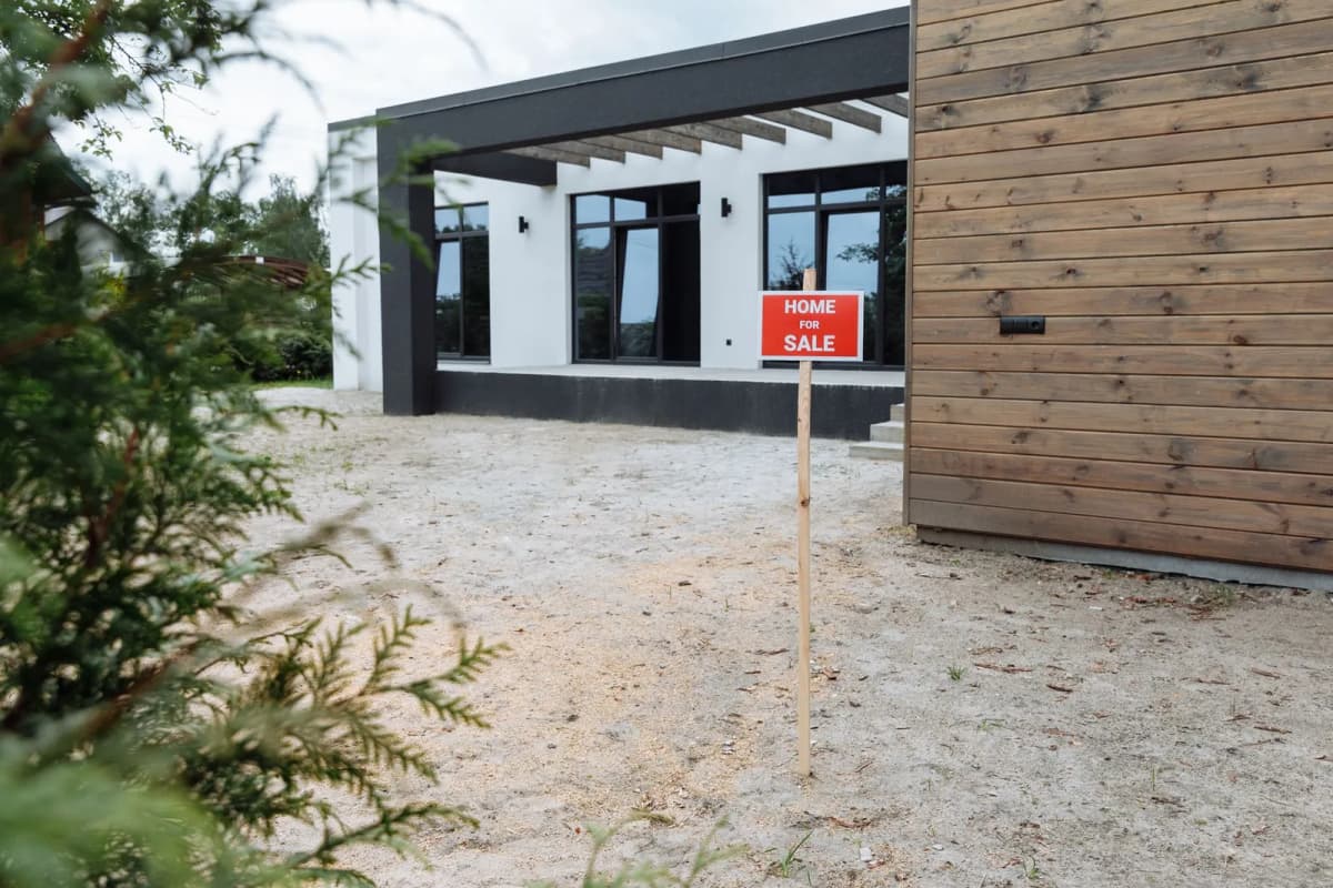 A home listed for sale, where an unresolved assessment lien surfaces at closing